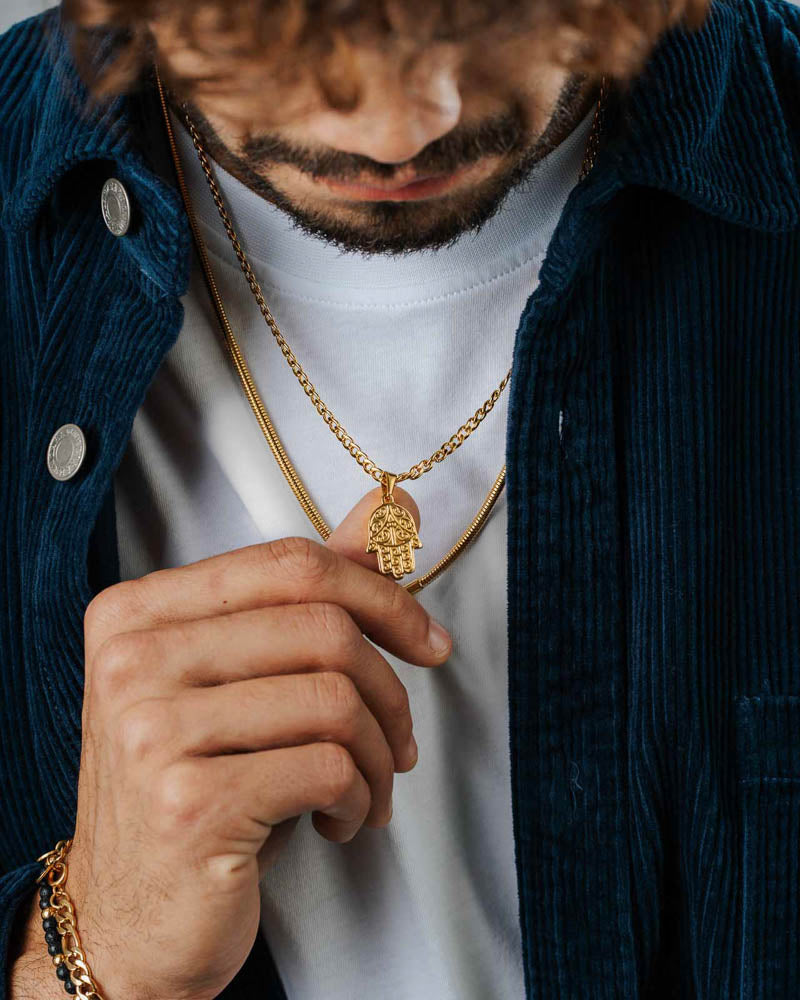 Hamsa - Golden Steel Necklace 'Hamsa' on the models neck - Buy Online Unissex Necklaces - Dicci