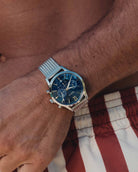 Chronometer watch - Blue dial with silver bracelet on the models wrist - Online Watches - Dicci